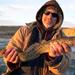 Photo of Fisherman holding a burbot caught in the Flaming Gorge during the 2010 Burbot Bash